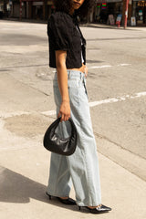 OVERSIZED CROSS-OVER JEANS